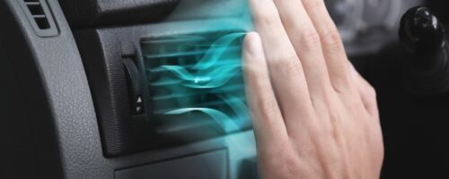 Driver,Checking,Flow,Of,Cold,Air,From,Conditioning,System,In